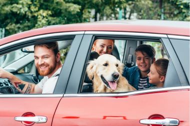 A Family in Jamaica Queens, NY Smiling After Finding Cheap Auto Insurance