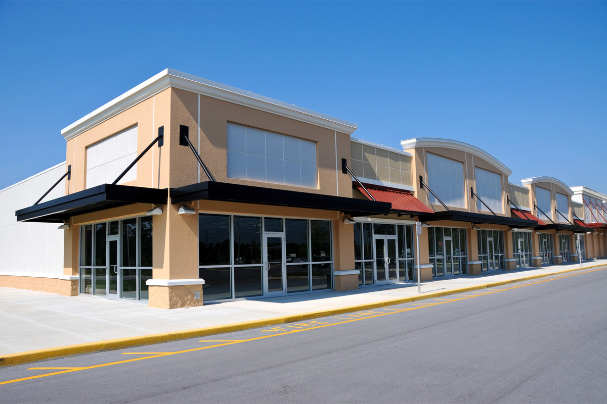buildings at a strip mall with Commercial Property Insurance